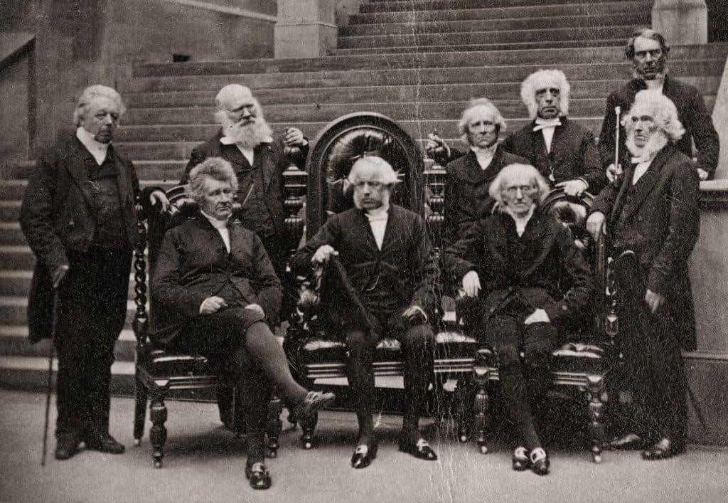 A historic group portrait on the steps of a financial institution